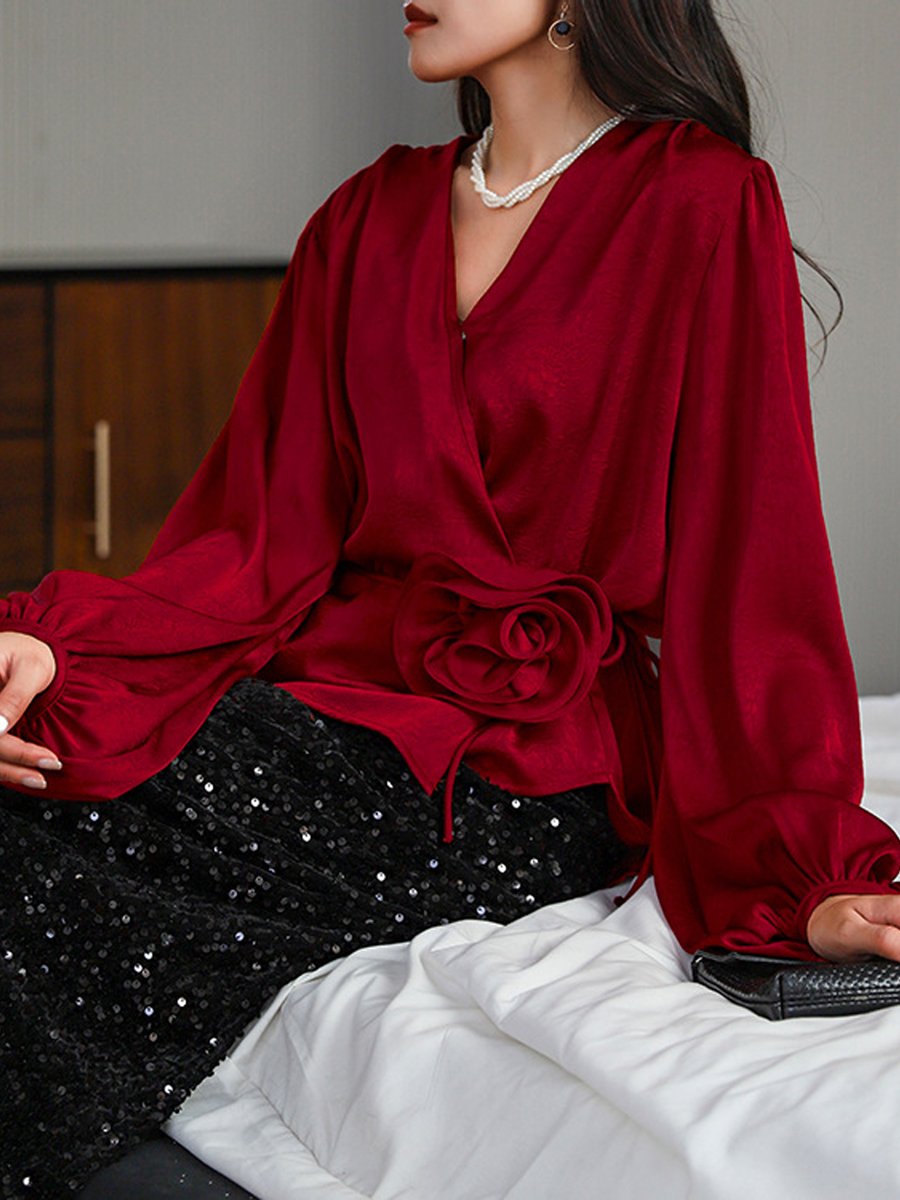 Stylish Wrap Blouse with Floral Accent