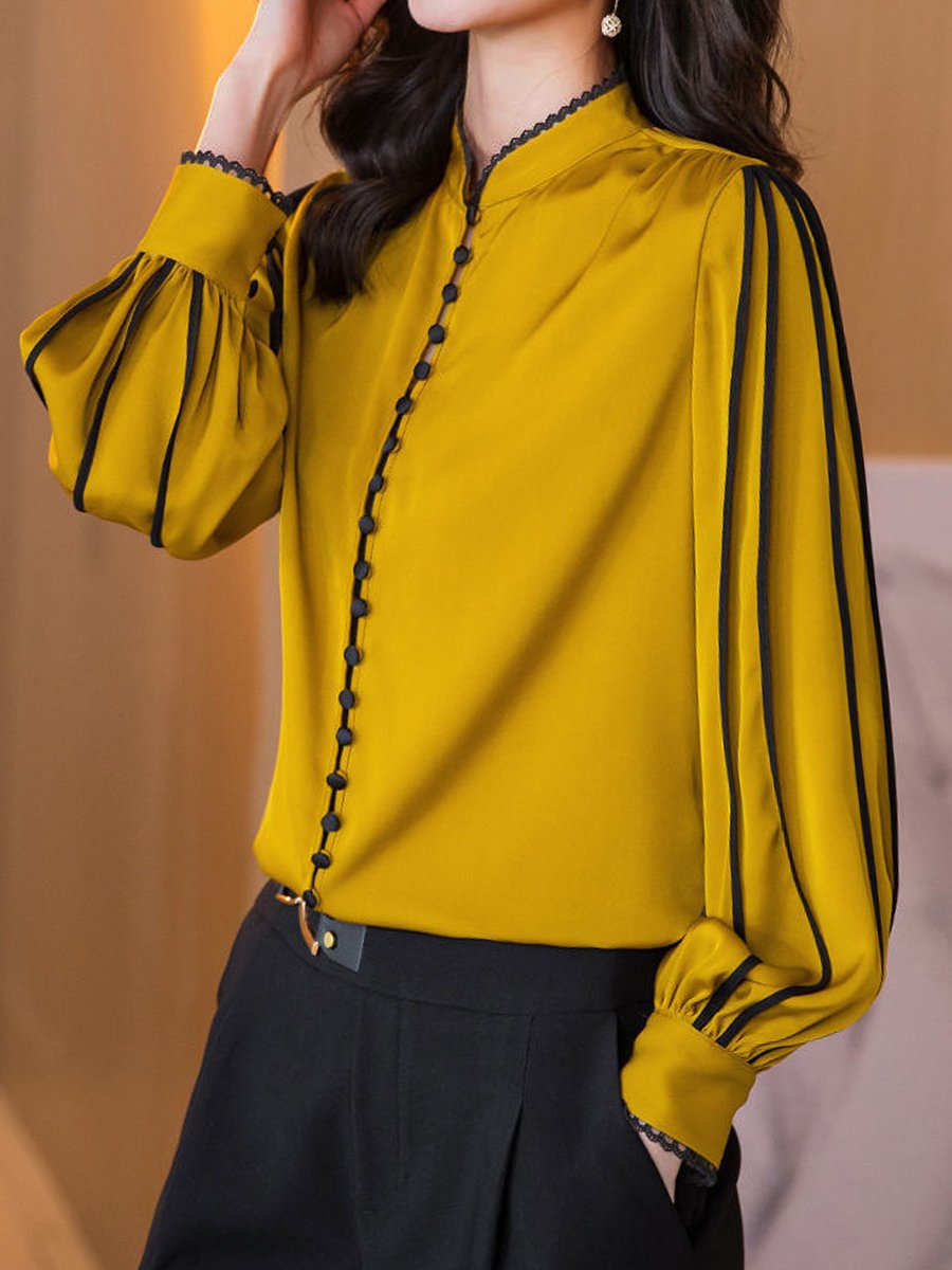 Elegant Blouse with Black Trim Accents